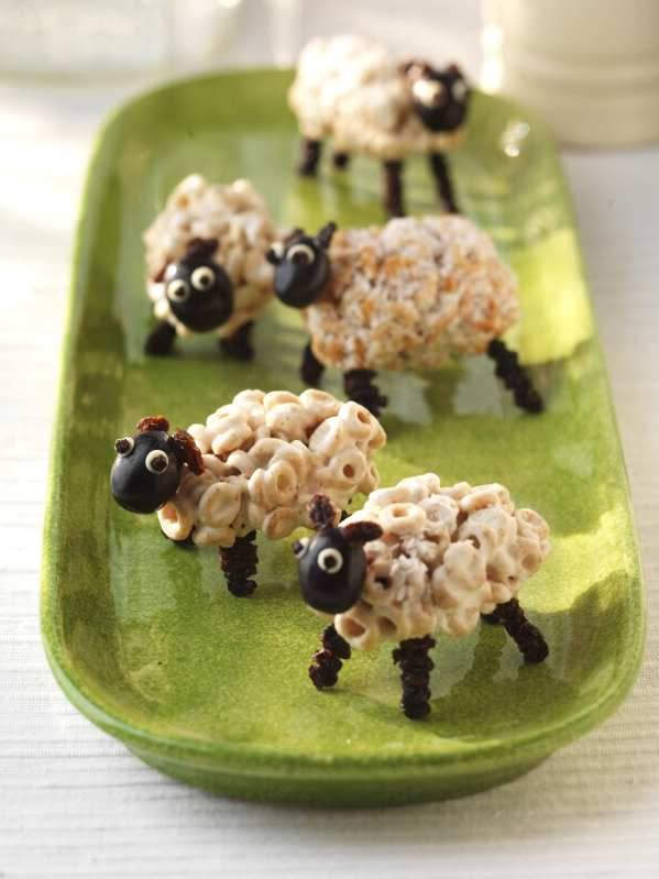 Edible fluffy sheep made from cereal, marshmallows, black grapes and raisins. An easy and fun DIY recipe to try with the kids for spring, Easter or any time!