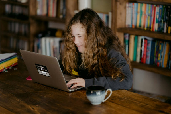 A girl studying with a laptop