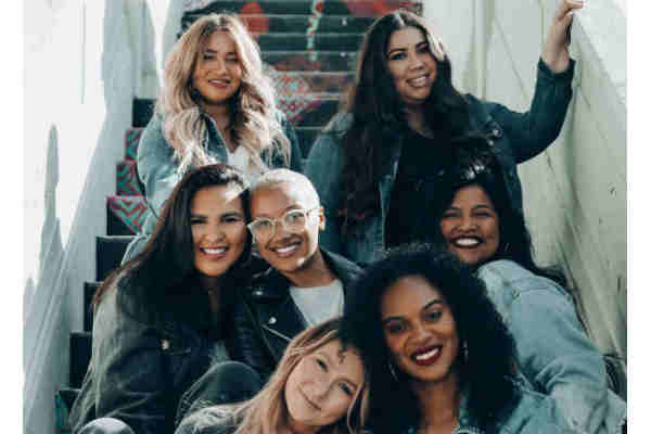 A group of women sitting on stairs