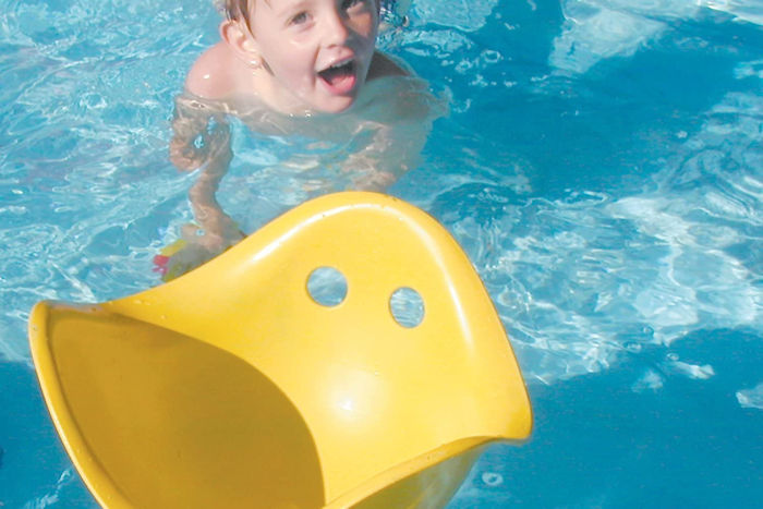 A Bilibo being used as a pool toy.