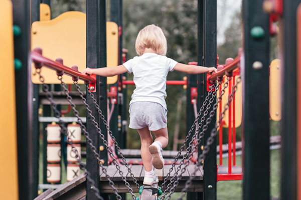 Child on an outdoor climbing frame